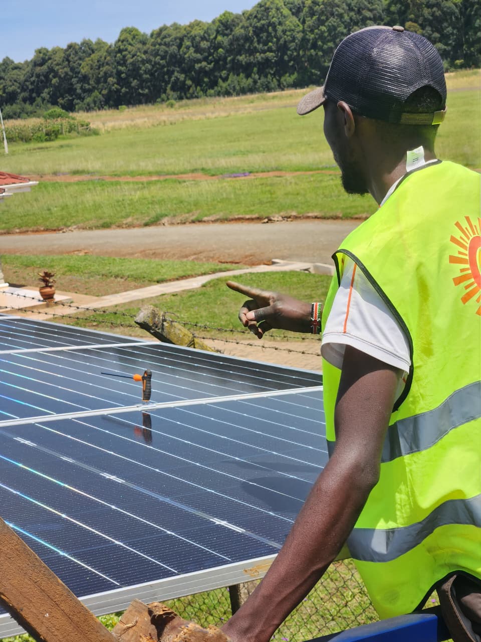 AFENERGY technician inspecting a completed rooftop solar array