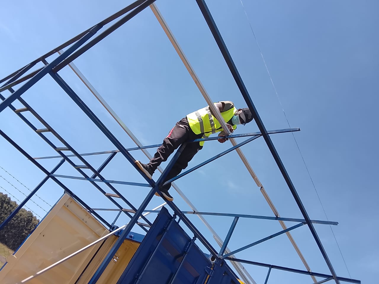 AFENERGY fabricator welding a ground-mount support frame