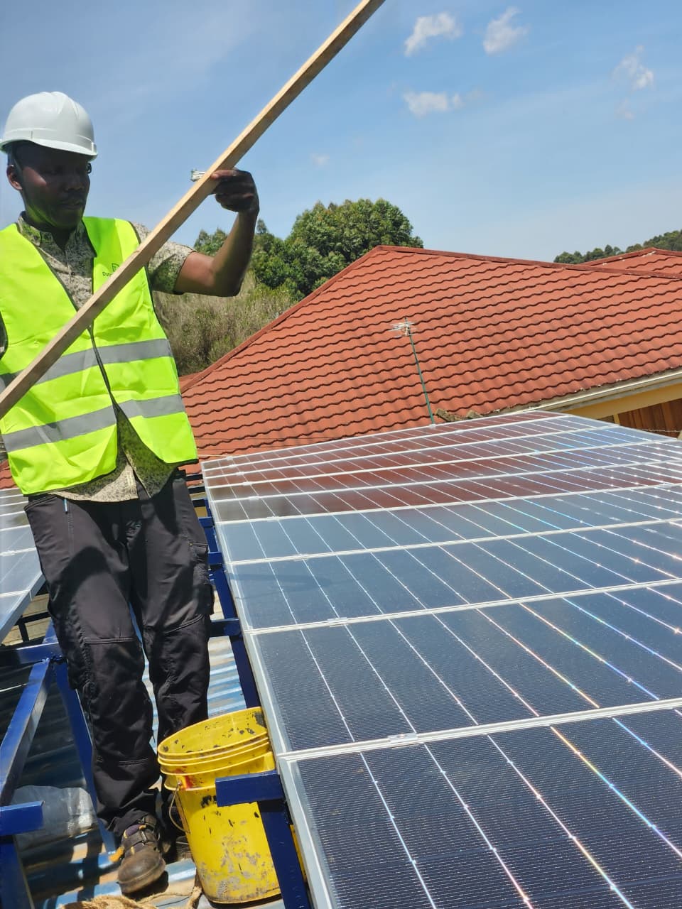 AFENERGY technician levelling a rooftop mounting rail