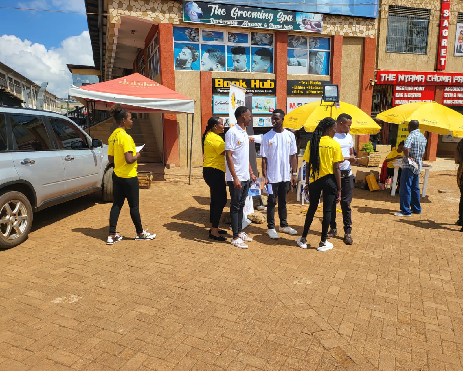 AFENERGY team engaging shoppers at a branded activation stand